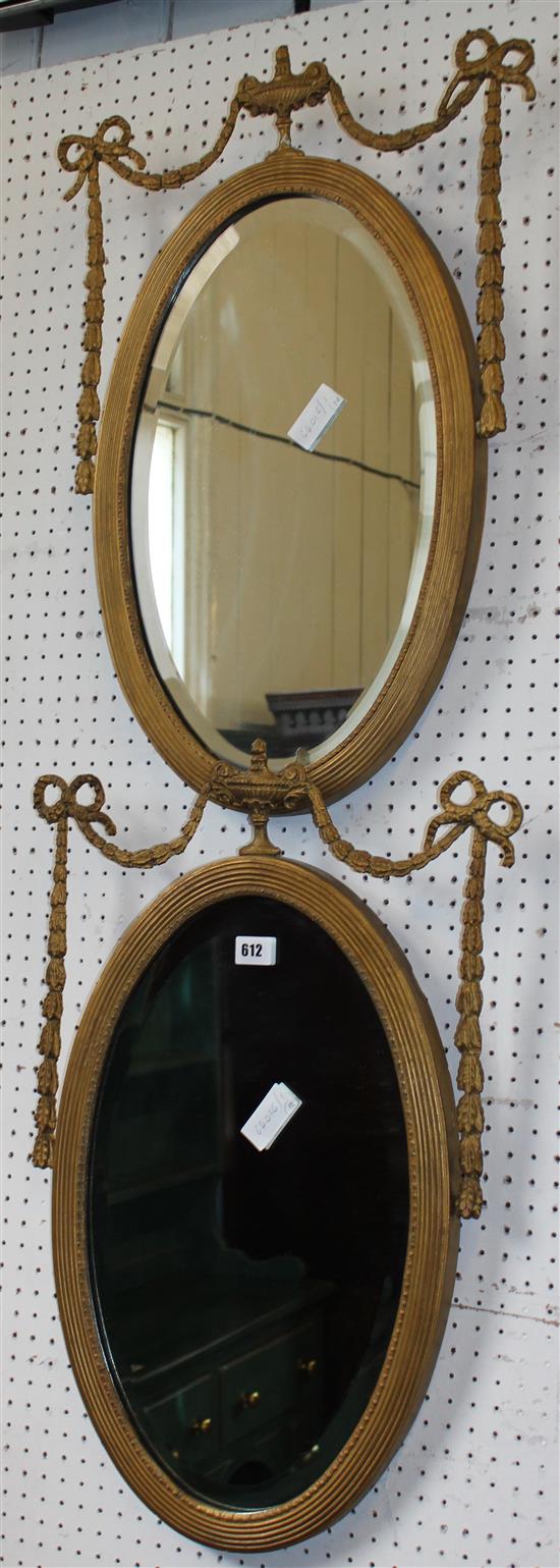 Pair of early 20th century oval gilt wall mirrors